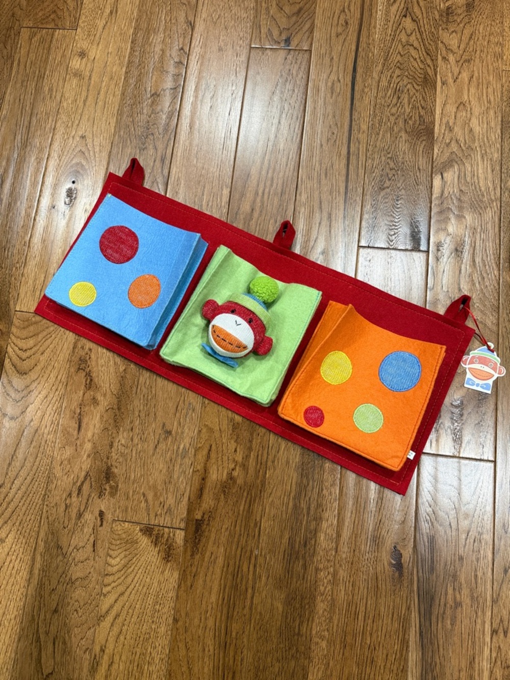 Skip Hop Red Hanging Felt Organizer with Blue, Green, and Orange Pockets